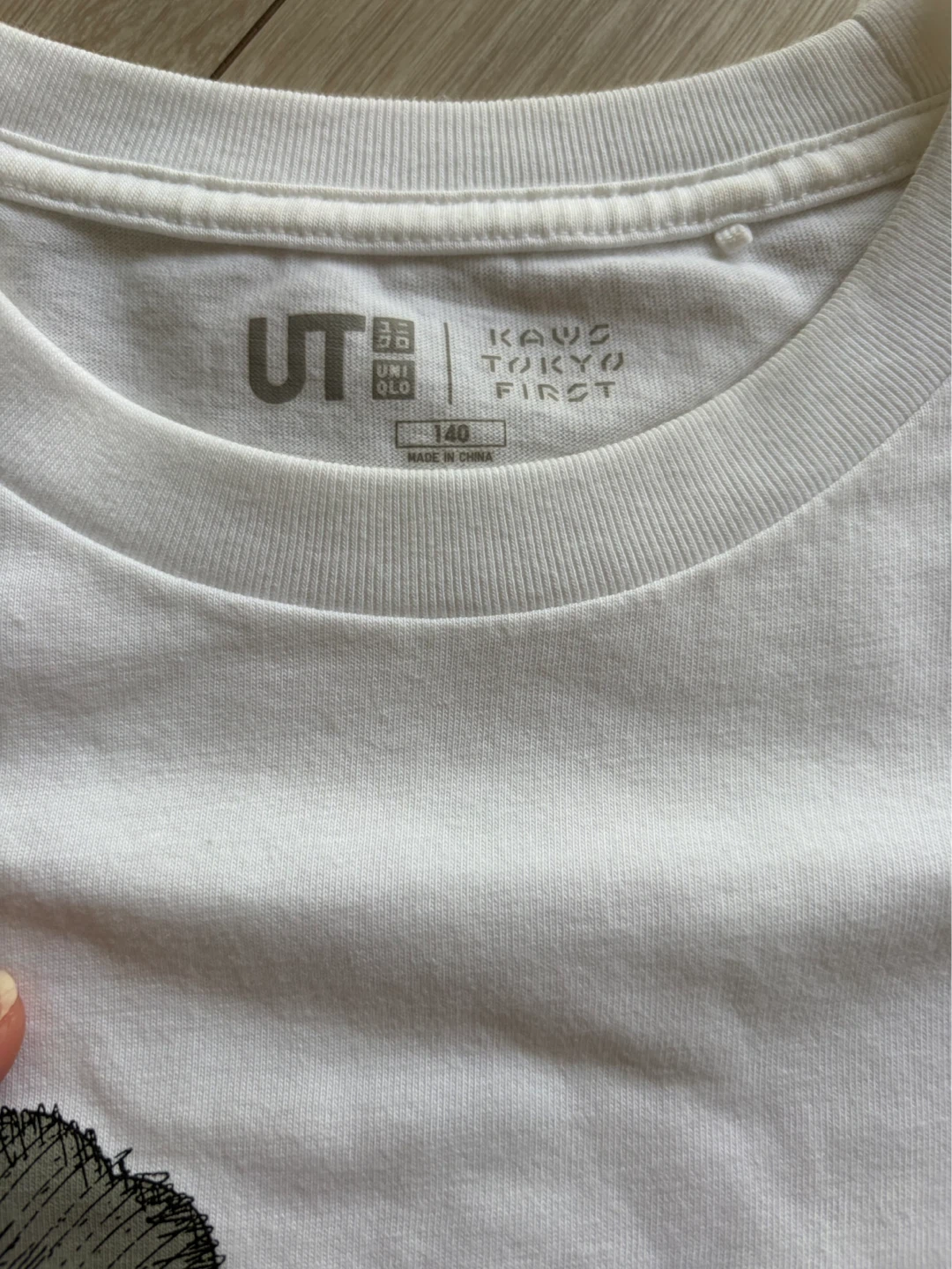 ユニクロ カウズ 半袖Tシャツ 白 140cmの写真2枚目